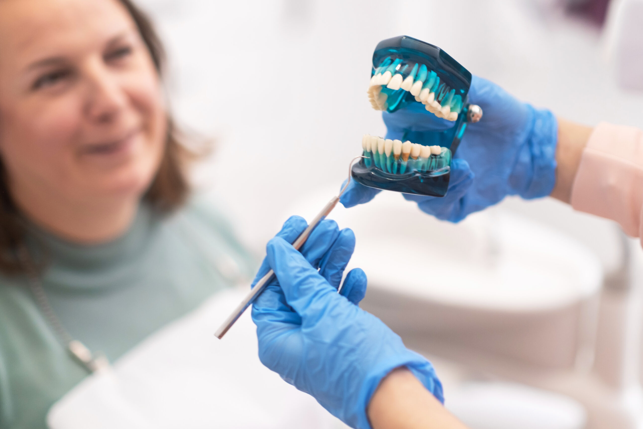 Dentist explaining a dental implant treatment plan to a patient