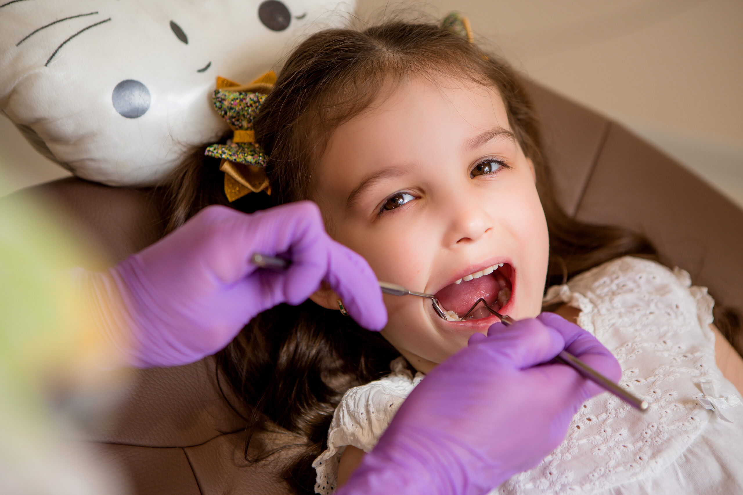 Child smiling during an orthodontic evaluation at Comprehensive Family Dentistry