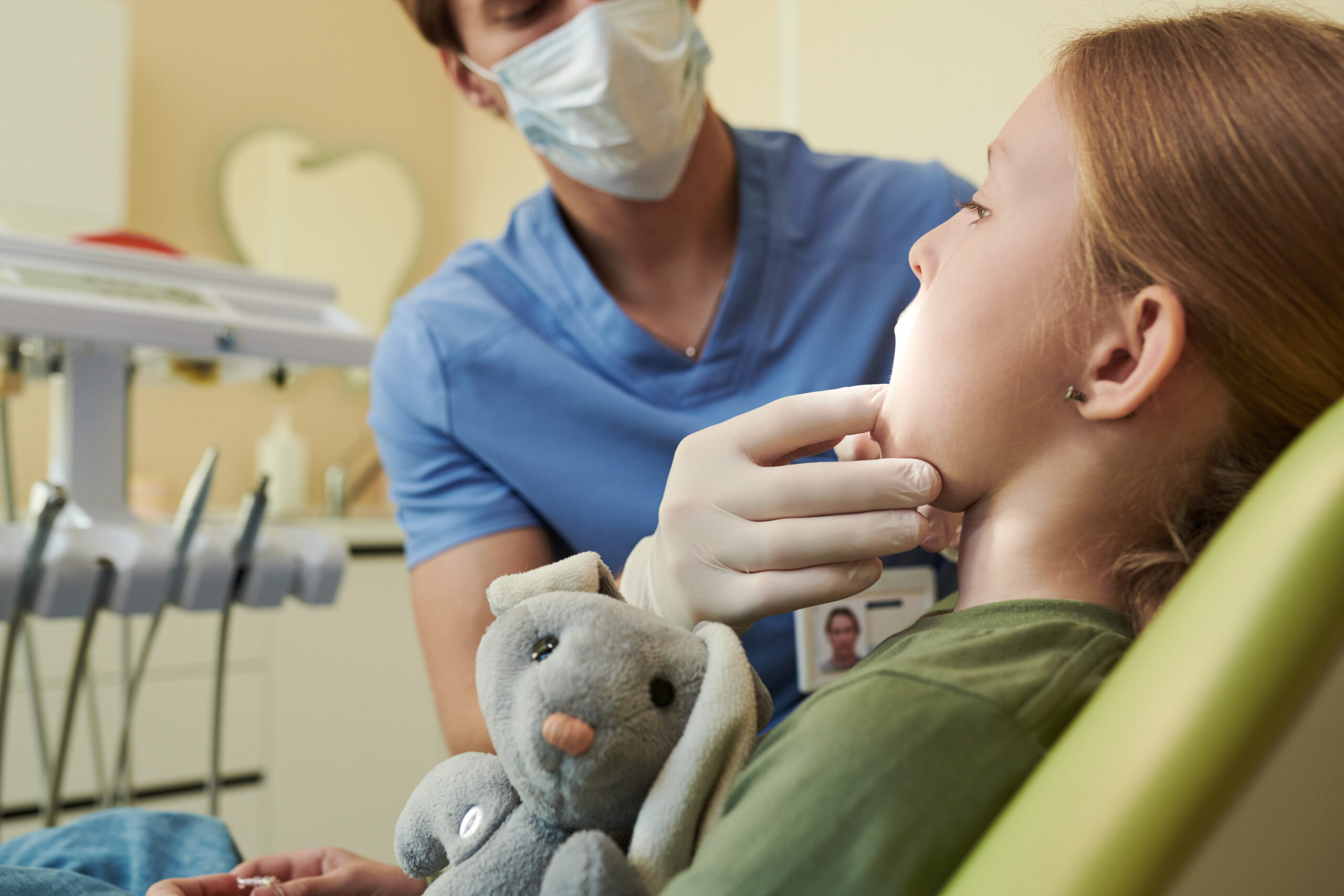 Child receiving a dental and orthodontic evaluation