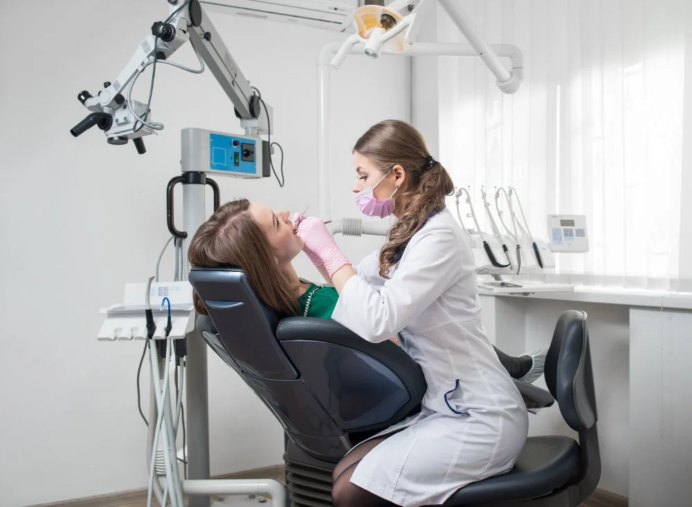 Dentist treating a patient at a dental clinic