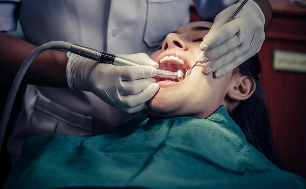 Dentist treating a patient during a dental implant consultation