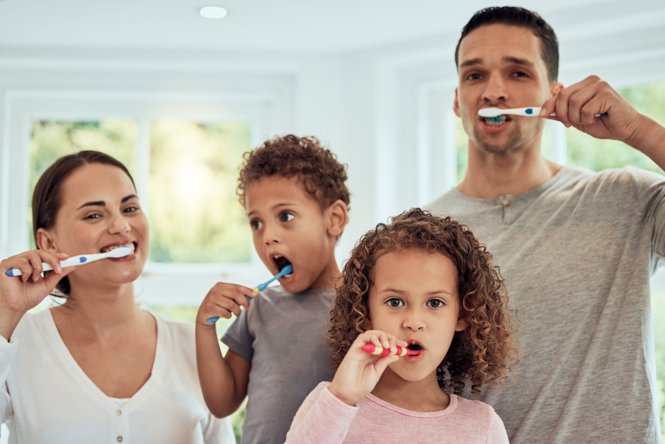 Family practicing preventive dental care